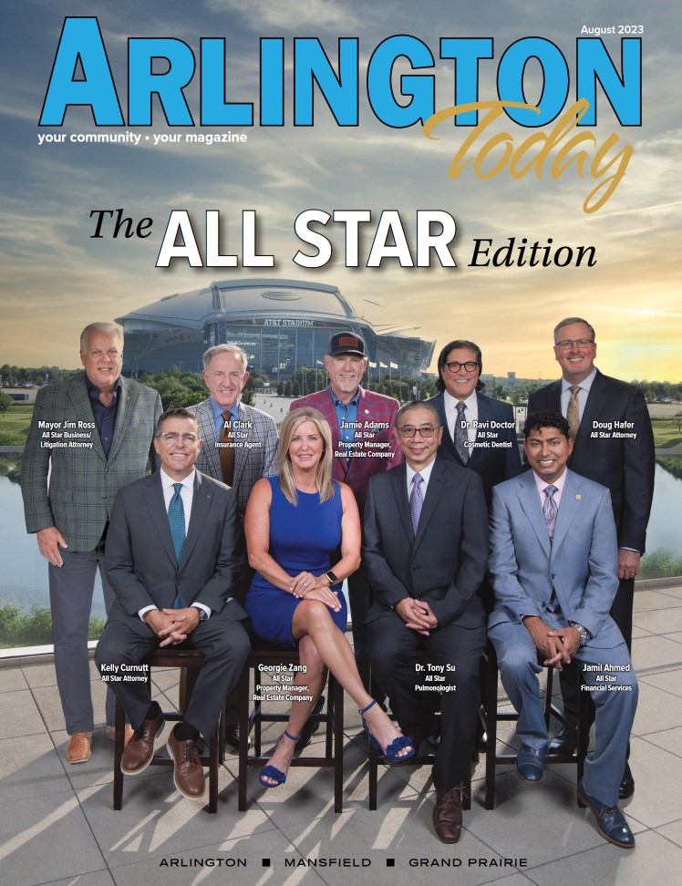 Cover of Arlington Today (August 2023) featuring a group of nine professionals from various fields posing outdoors with AT&T Stadium in the background. The group includes Dr. Ravi Doctor (cosmetic dentist), attorneys, a pulmonologist, a financial services expert, real estate professionals, and an insurance agent. The text highlights it as "The All-Star Edition.