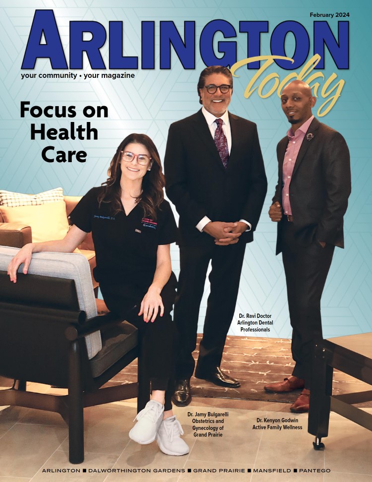 Cover of Arlington Today magazine, February 2024 issue. The title is in bold blue and yellow letters. The main headline reads "Focus on Health Care." The cover features three professionals: a woman in black medical scrubs sitting on a modern chair with white sneakers, and two men in suits standing beside her. The woman is identified as Dr. Jamy Bulgarelli (Obstetrics and Gynecology of Grand Prairie), while the men are Dr. Ravi Doctor (Arlington Dental Professionals) and Dr. Kenyon Godwin (Active Family Wellness).